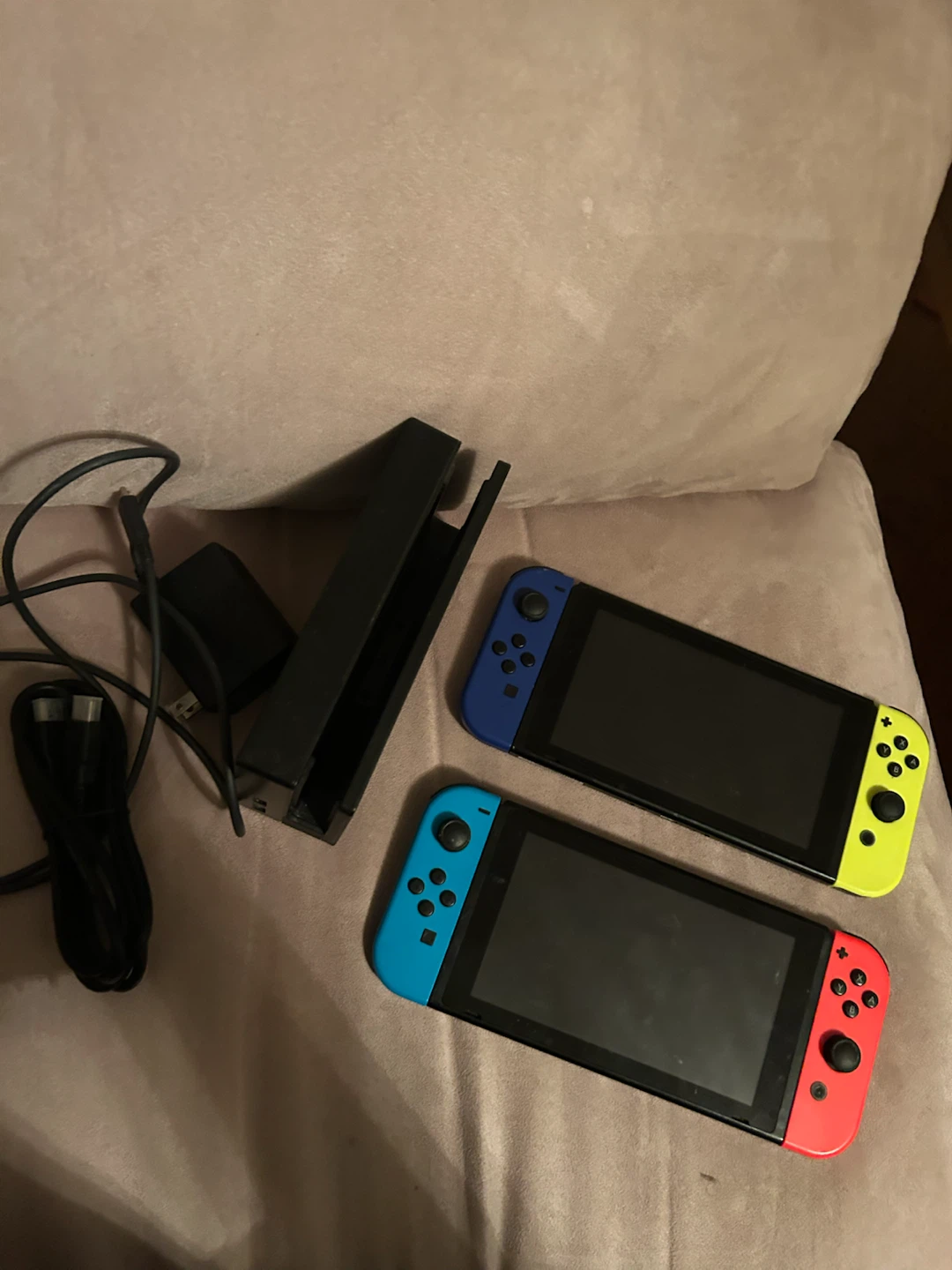 Two Nintendo Switch consoles with dock and cables - photo 4