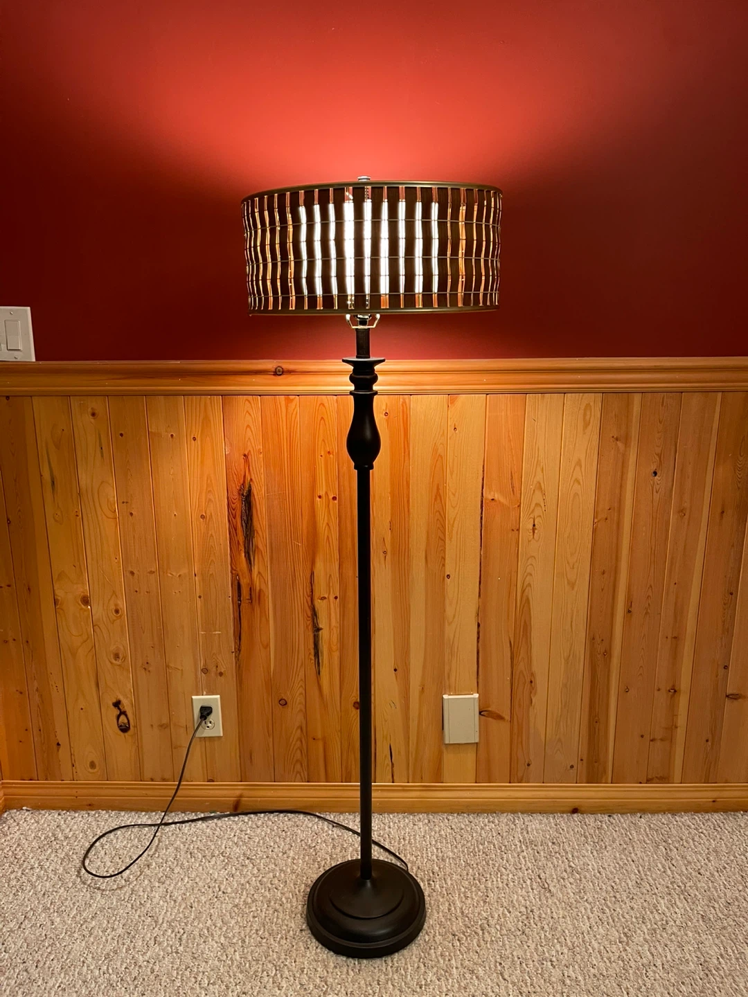 A beautiful floor lamp with fibre glass and wooden lamp shade