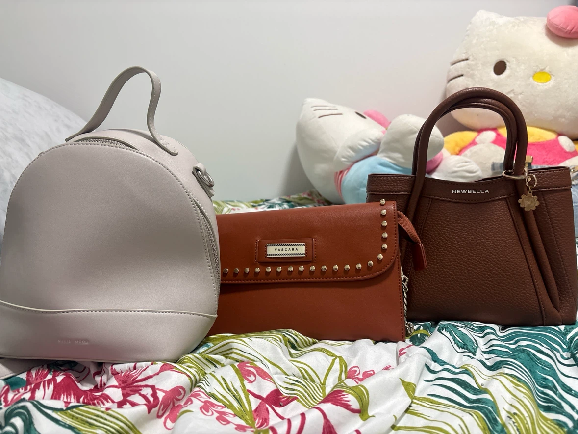 Three assorted fashion handbags