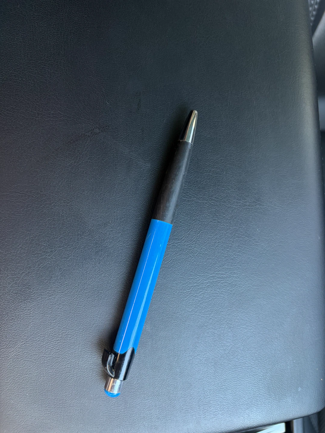 Blue and black retractable ballpoint pen