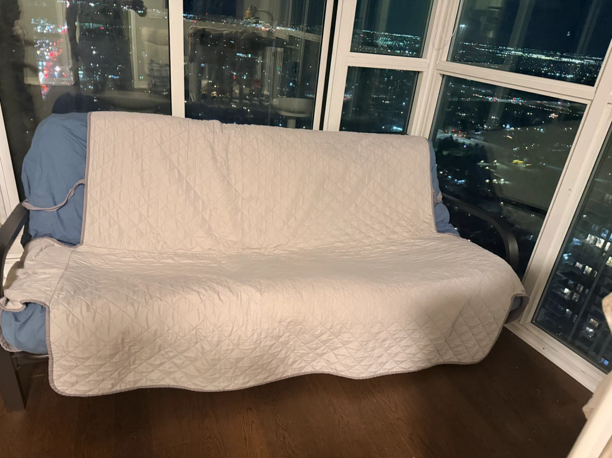 Blue Futon with Quilted Cover