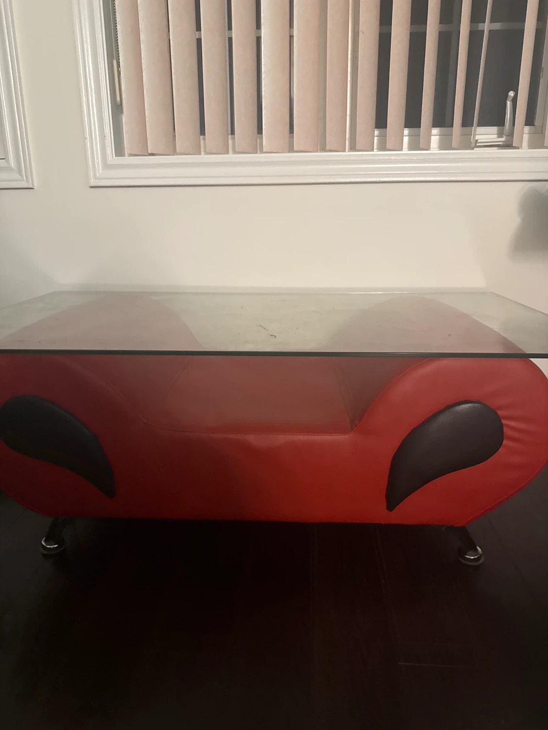 Red and black coffee table with glass top