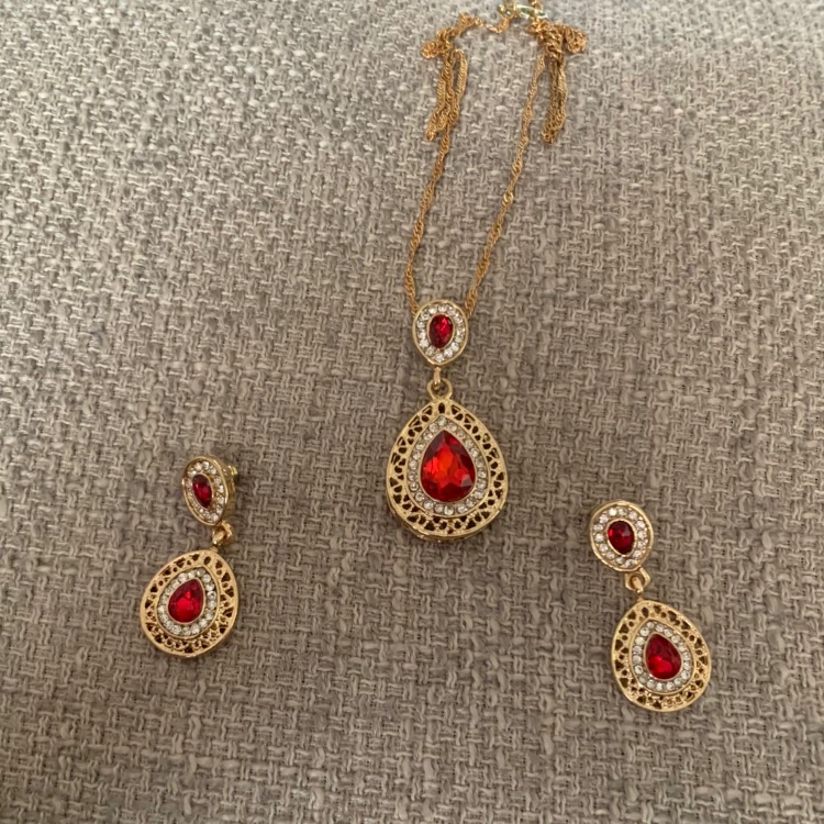 Gold-tone red stone necklace and earring set
