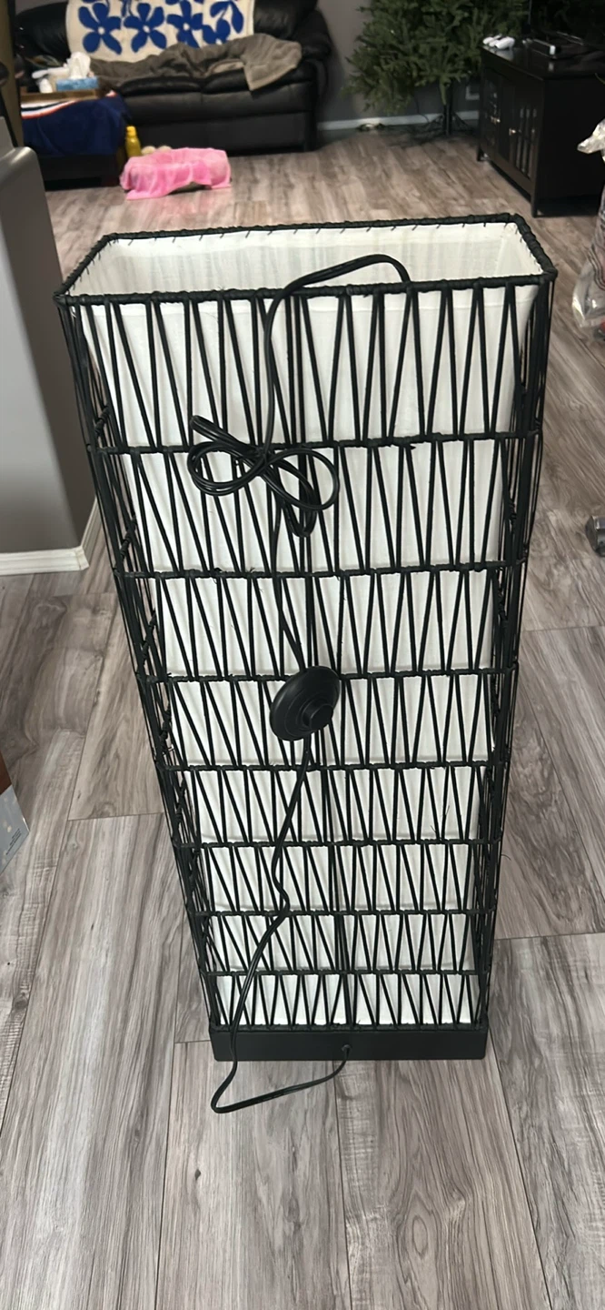 Tall black wire floor lamp with white shade