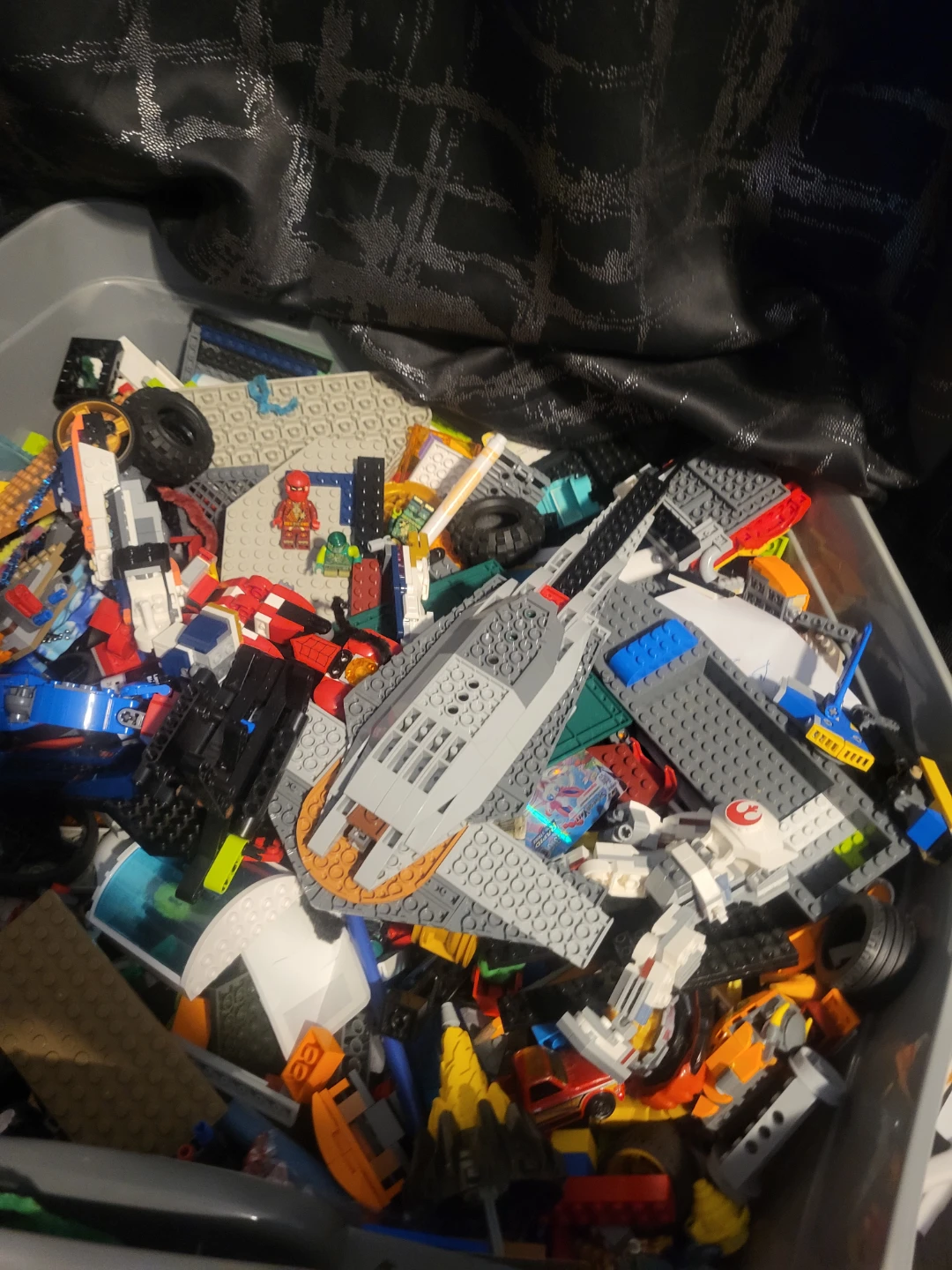 Assorted Lego Bricks and Minifigures