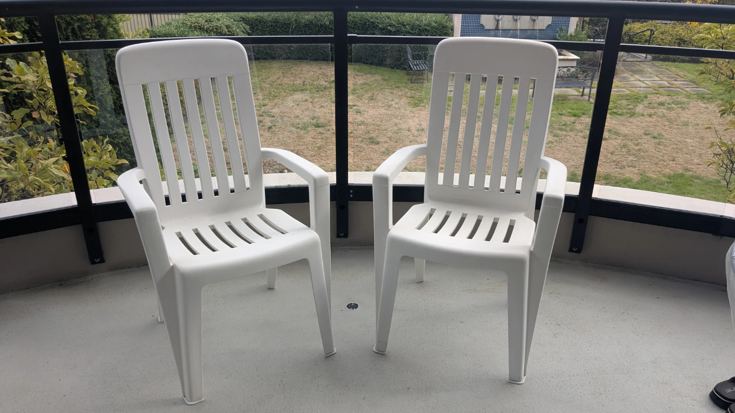 Two White Plastic Patio Chairs - photo 2