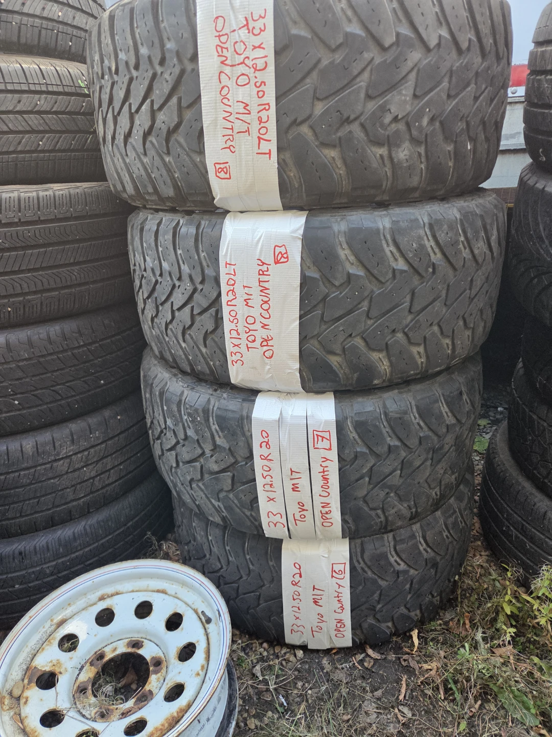 4 Toyo Open Country M/T Tires 33x12.50R20LT