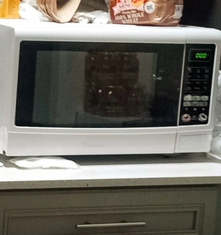 Microwave Oven White very heavy, pick up only, at exact streets