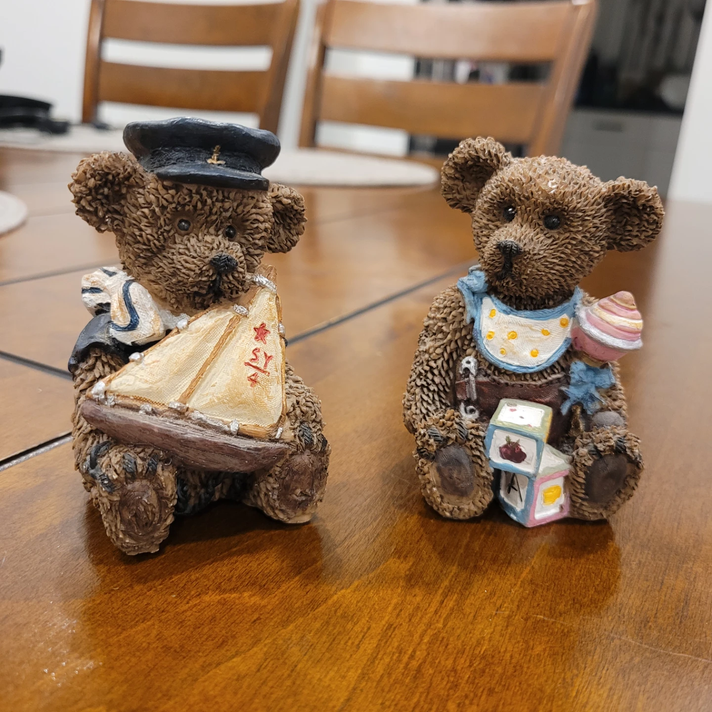 Two decorative teddy bear figurines