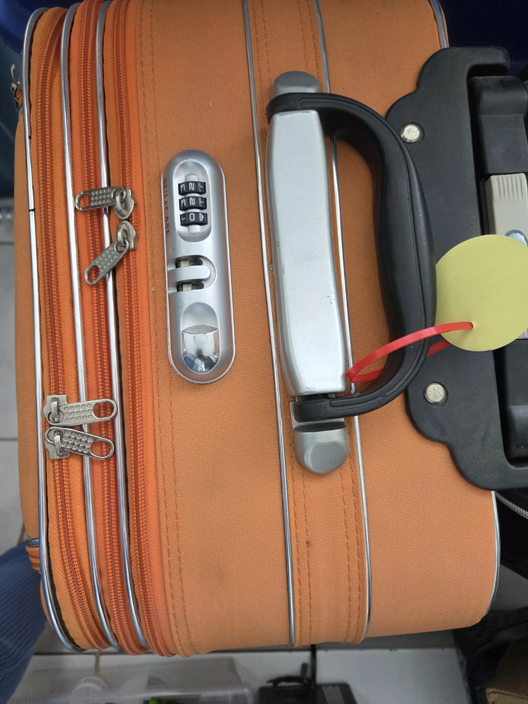 Orange rolling suitcase with combination lock - photo 2