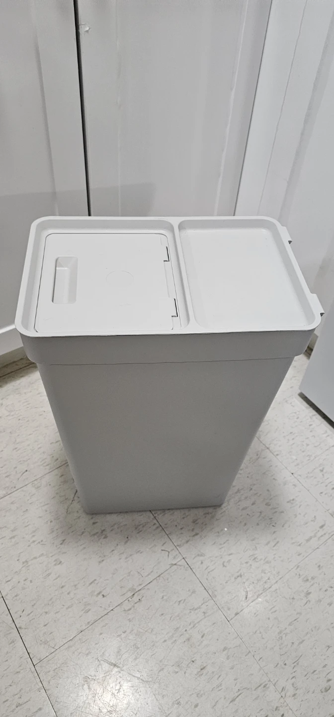 Gray plastic waste bin