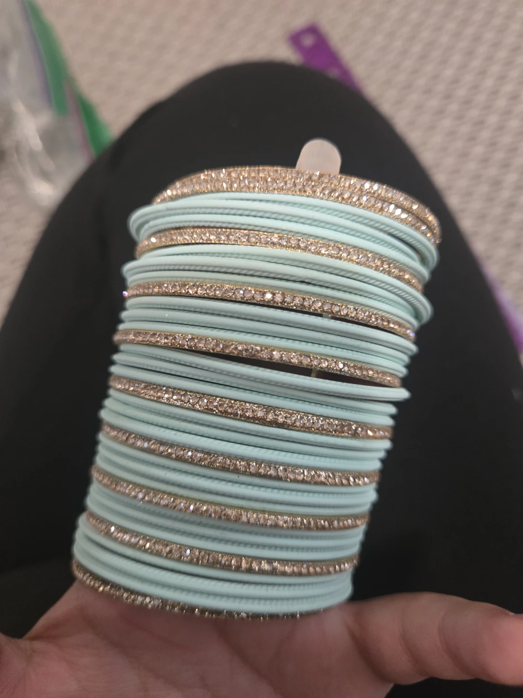 Set of mint green and gold tone bangles