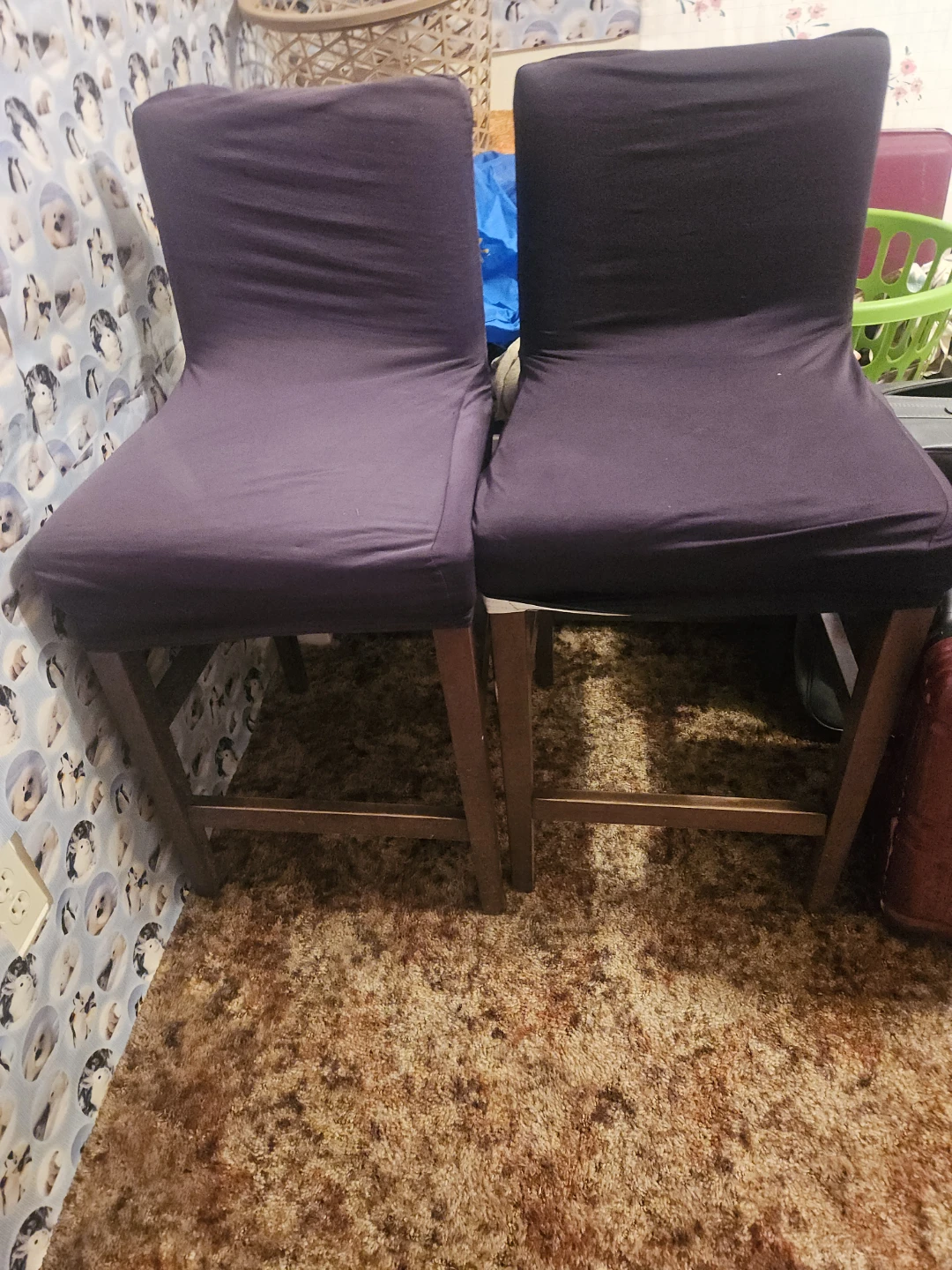 Two dark purple counter height stools