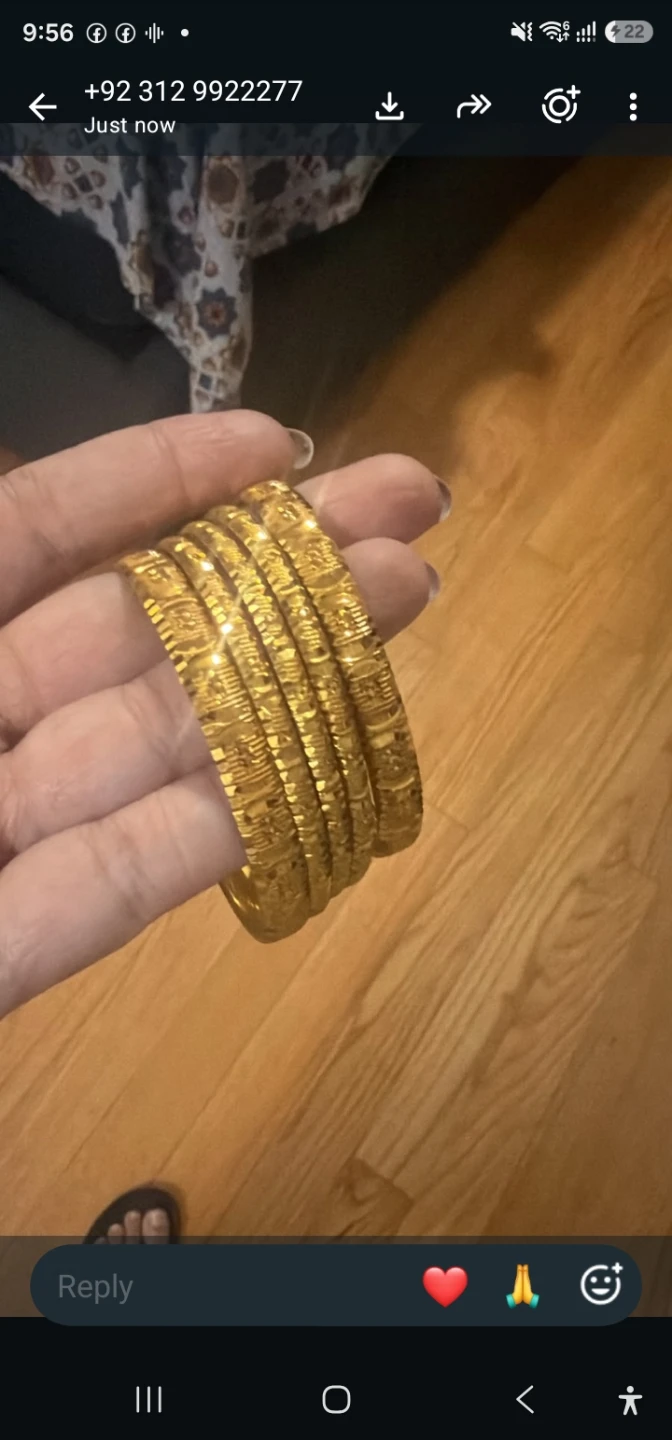 Set of four gold-tone bangles