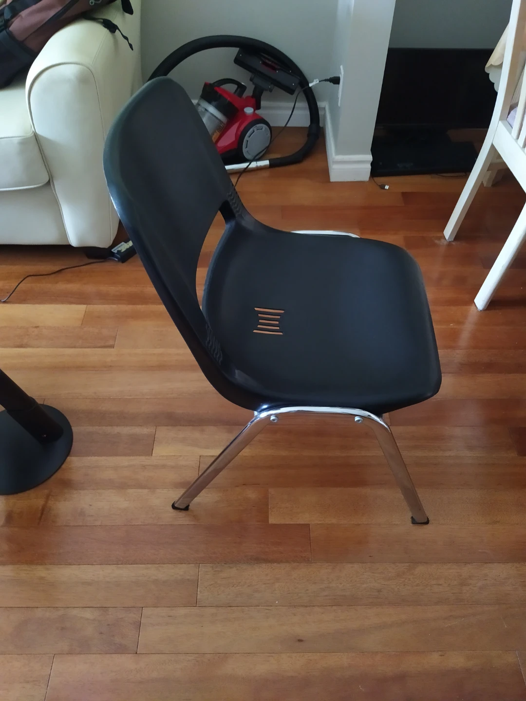 Black plastic stacking chair with chrome legs - photo 3