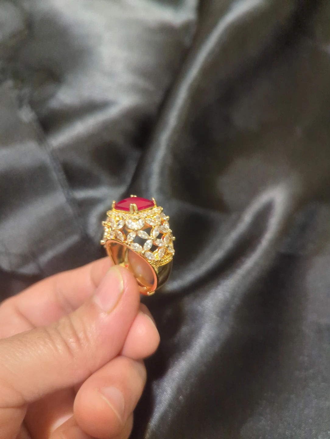 Gold-tone statement ring with red stone