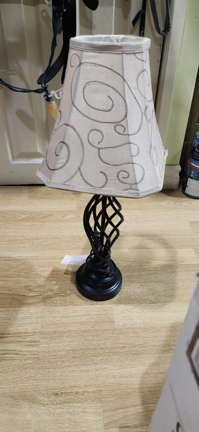 Table lamp with twisted black metal base