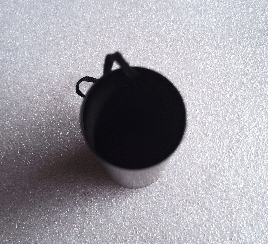 Black cylindrical container with hanging string - photo 2