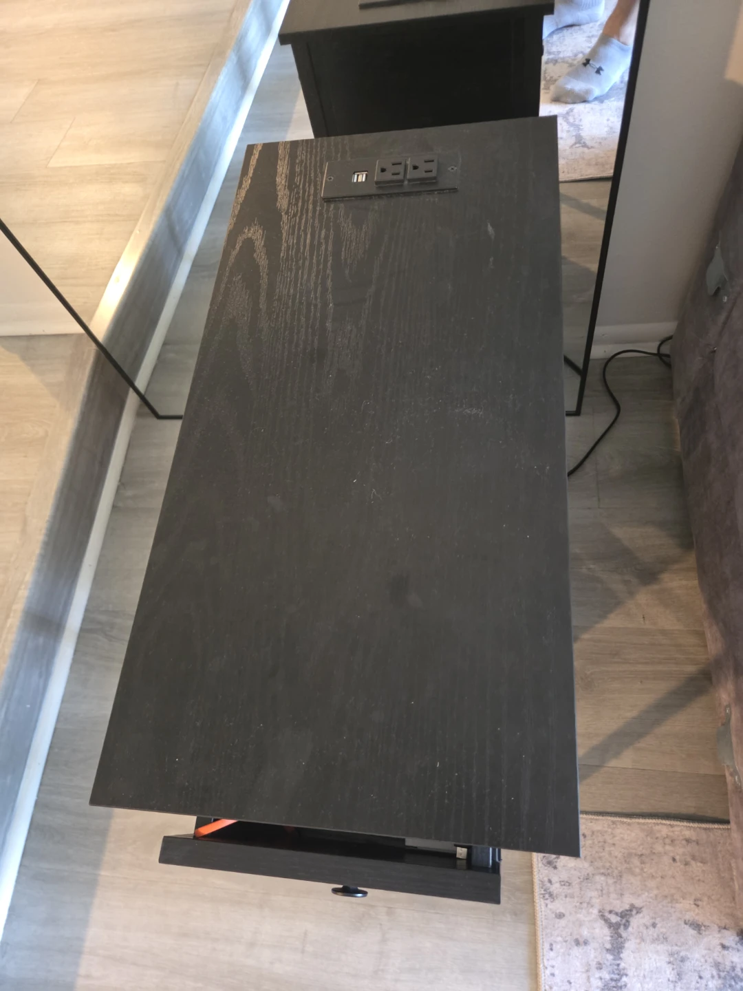 Black end table with built-in power outlets