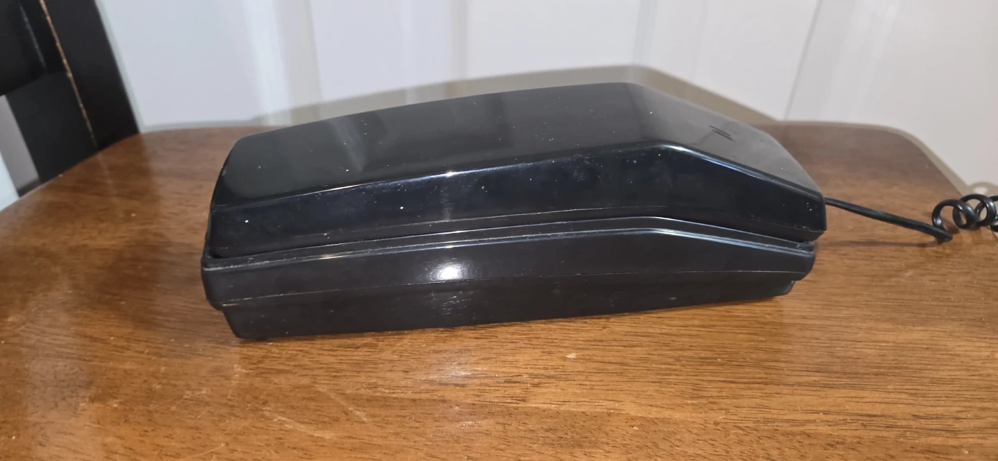 Vintage black wall-mount telephone
