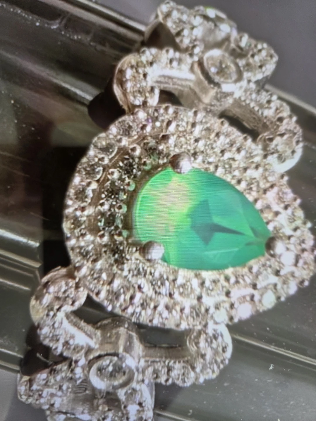 Silver (3.42g)  and CZ ring with green stone