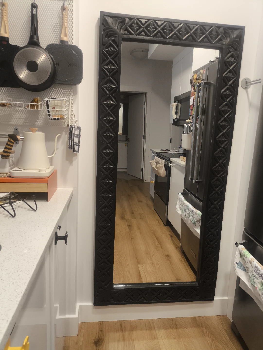 Mirror with carved wooden frame