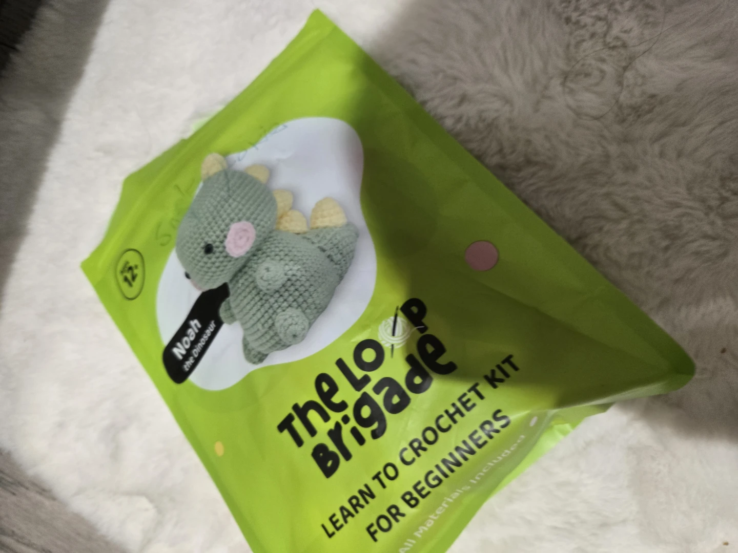 A full bag of crochet yarn and yarn with crochet hocks
