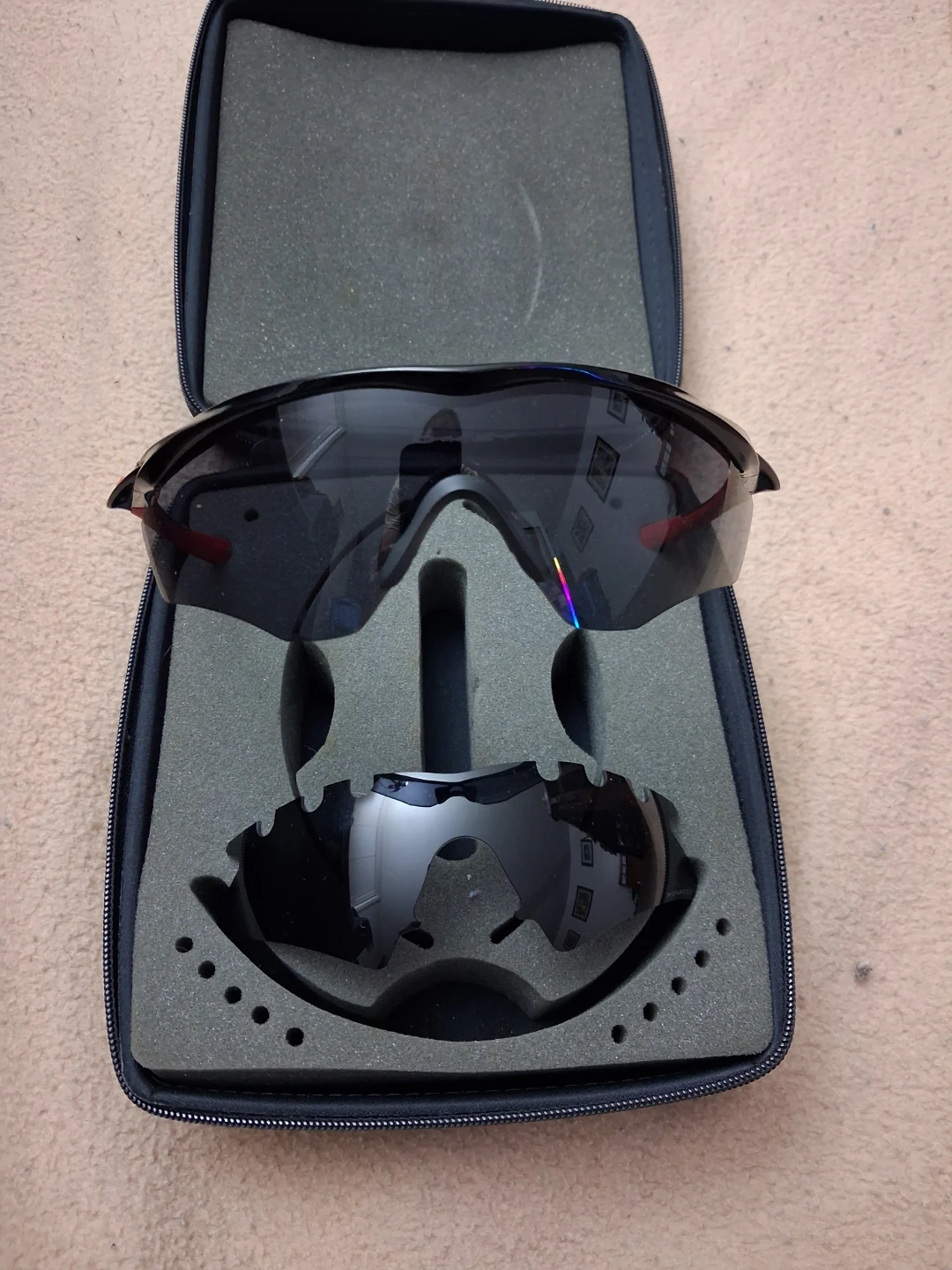 Oakley sunglasses with spare lens and hard storage case