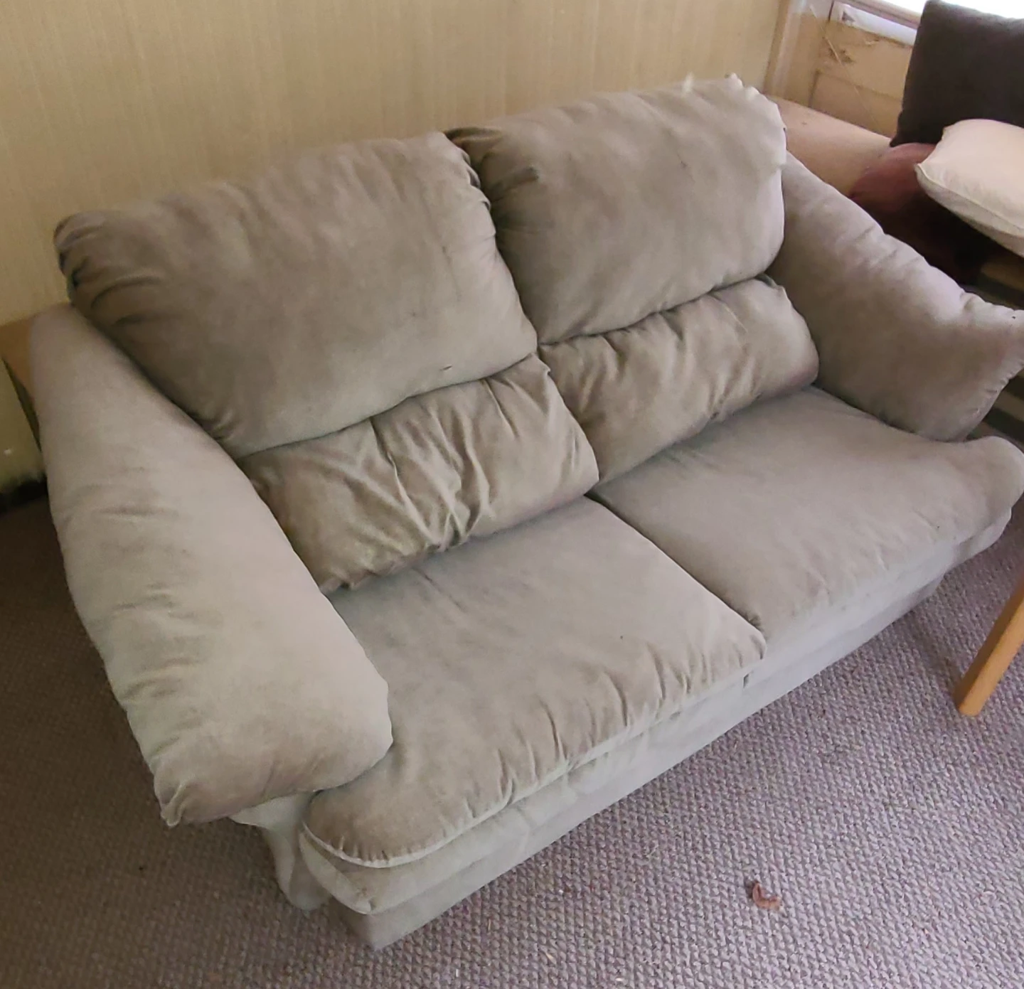 Beige two-seater sofa
