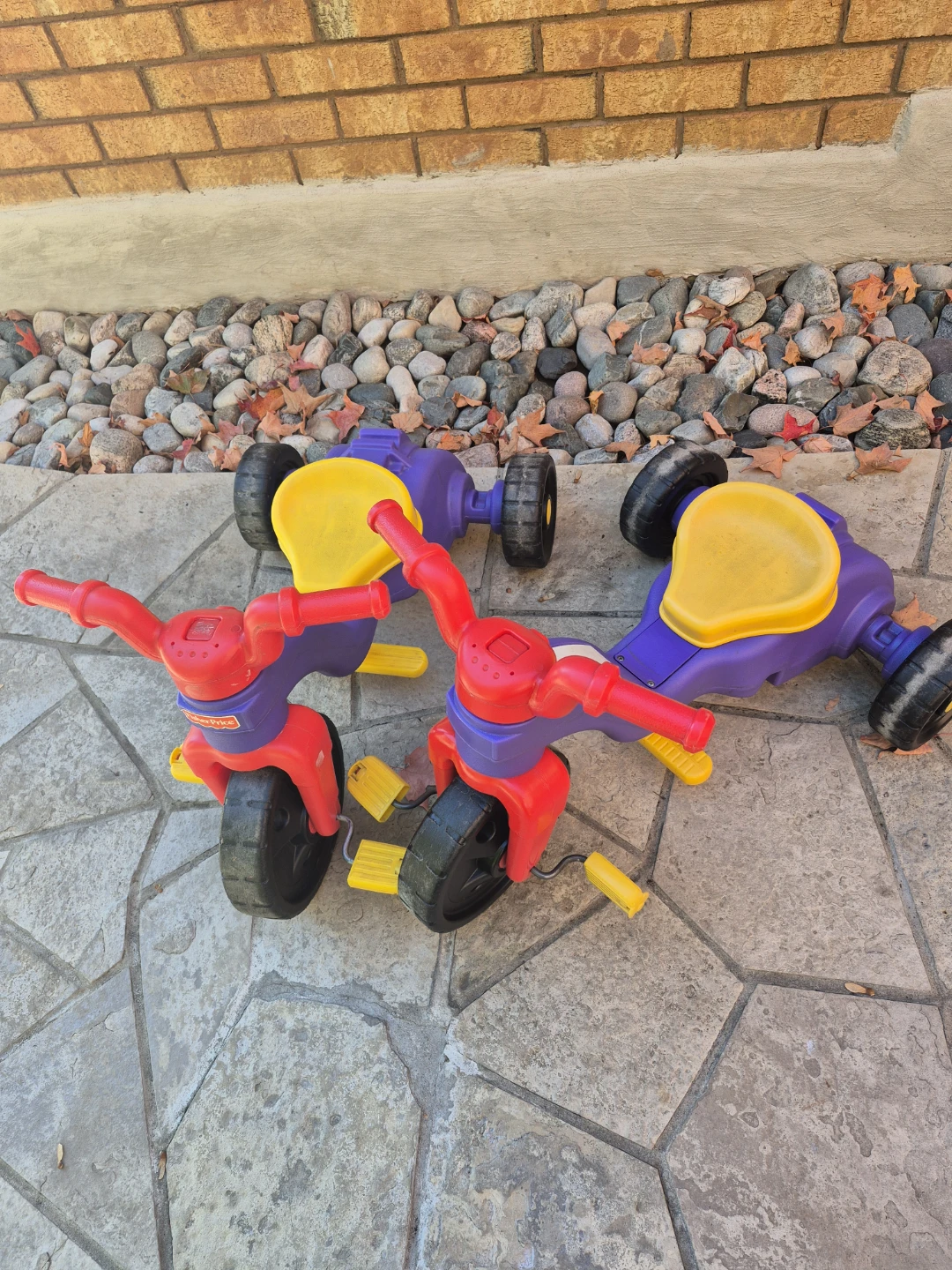 Two Fisher-Price Toddler Tricycles