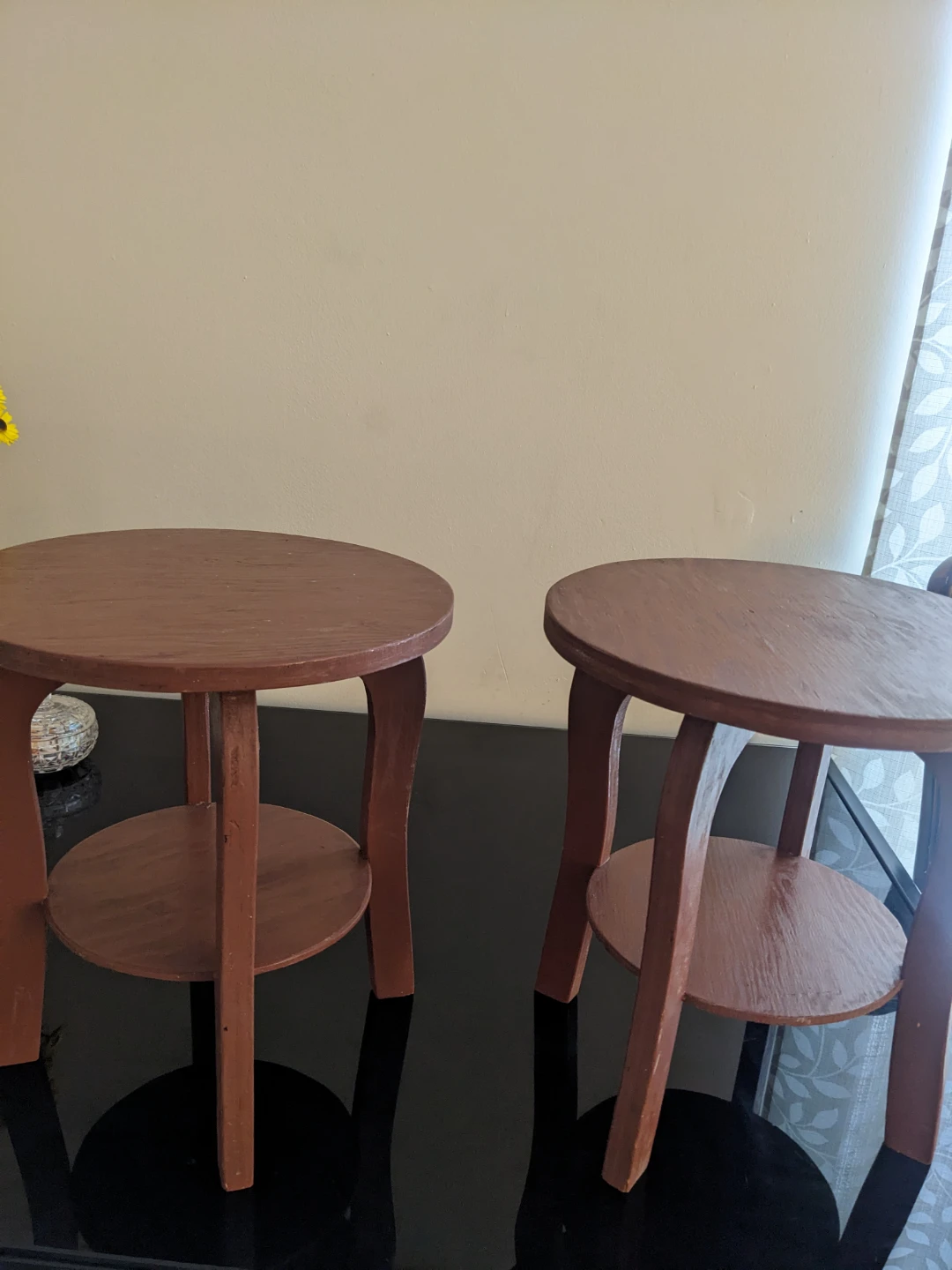 Set of two round wooden side tables