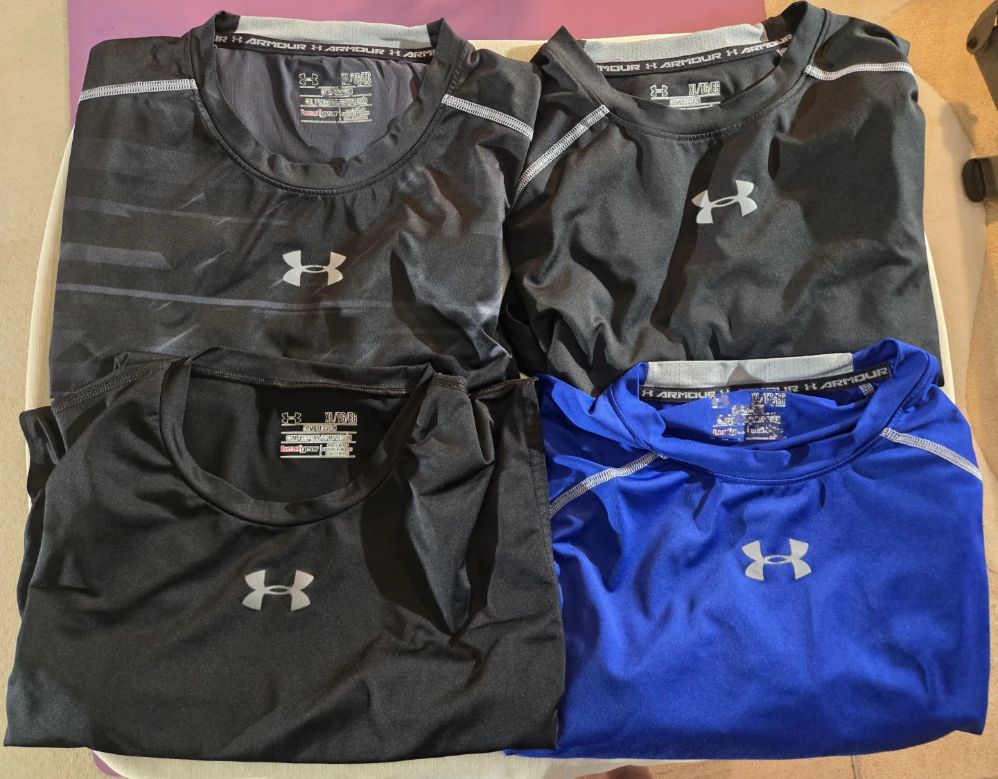 XL Compression Under Armour. 2 short sleeve, 2 sleeveless.Men's.