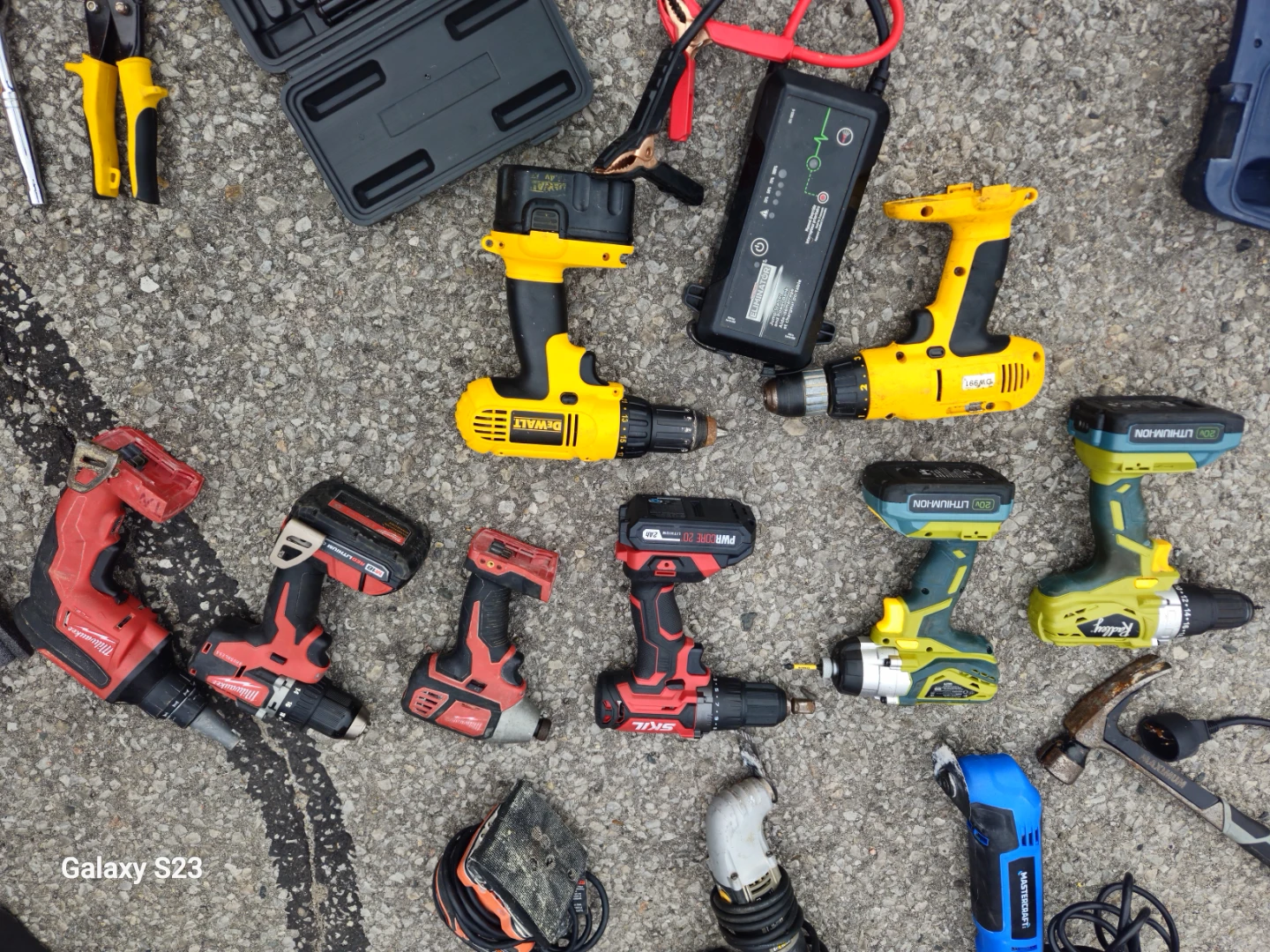 Assortment  of power tools and hand tools.