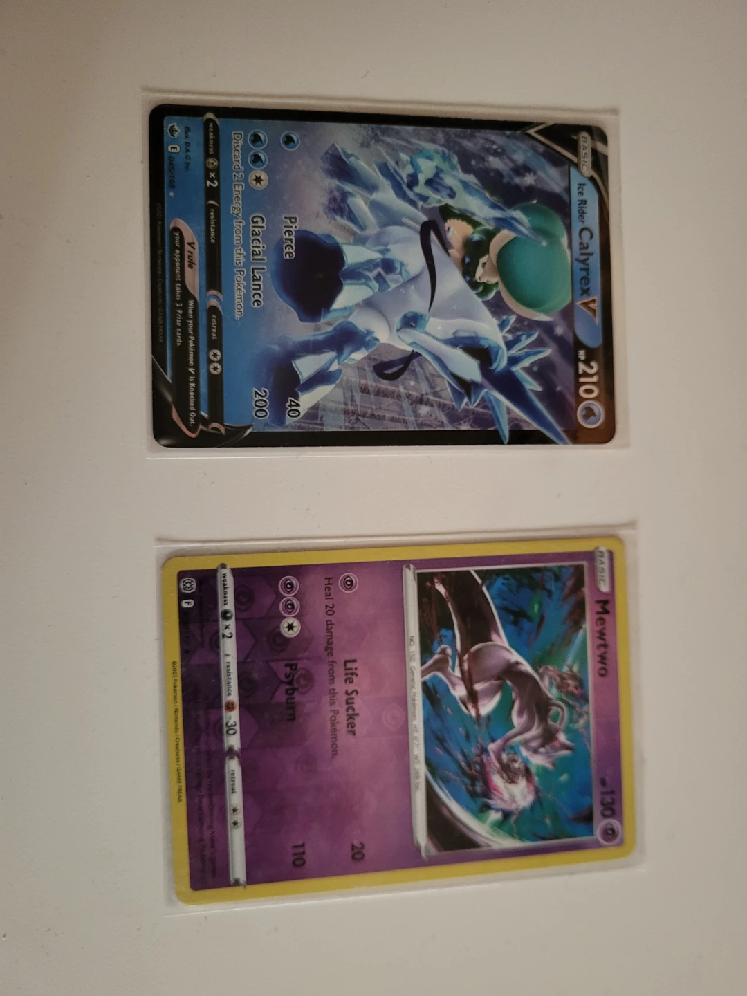 Ice Rider Calyrex V and Mewtwo Pokemon Cards