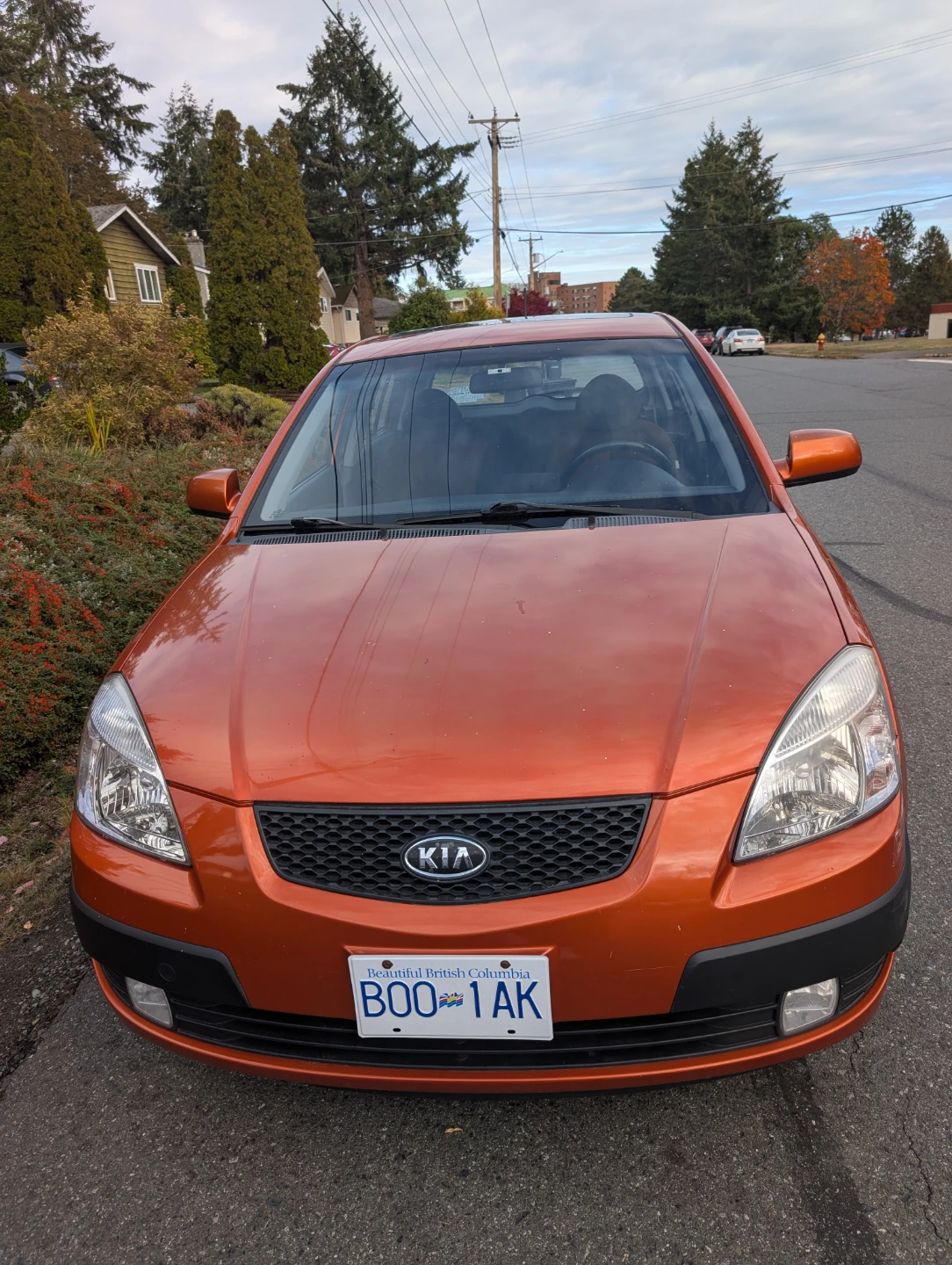 Orange Kia Rio5 hatchback