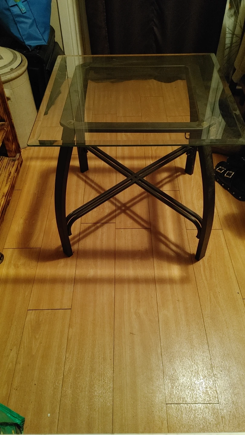 Glass top end table with metal base