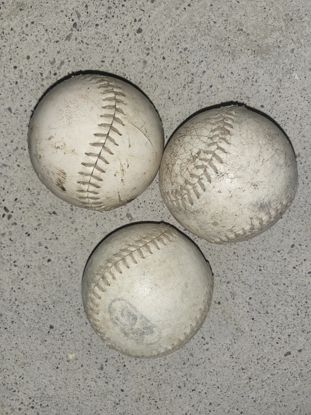 Three Rawlings baseballs