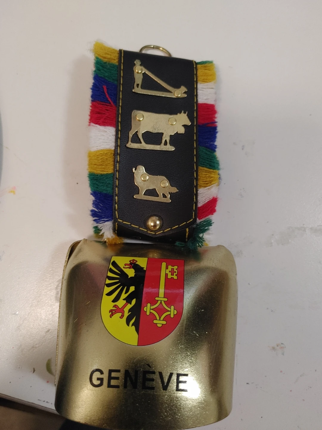 Swiss souvenir cowbell with decorative strap