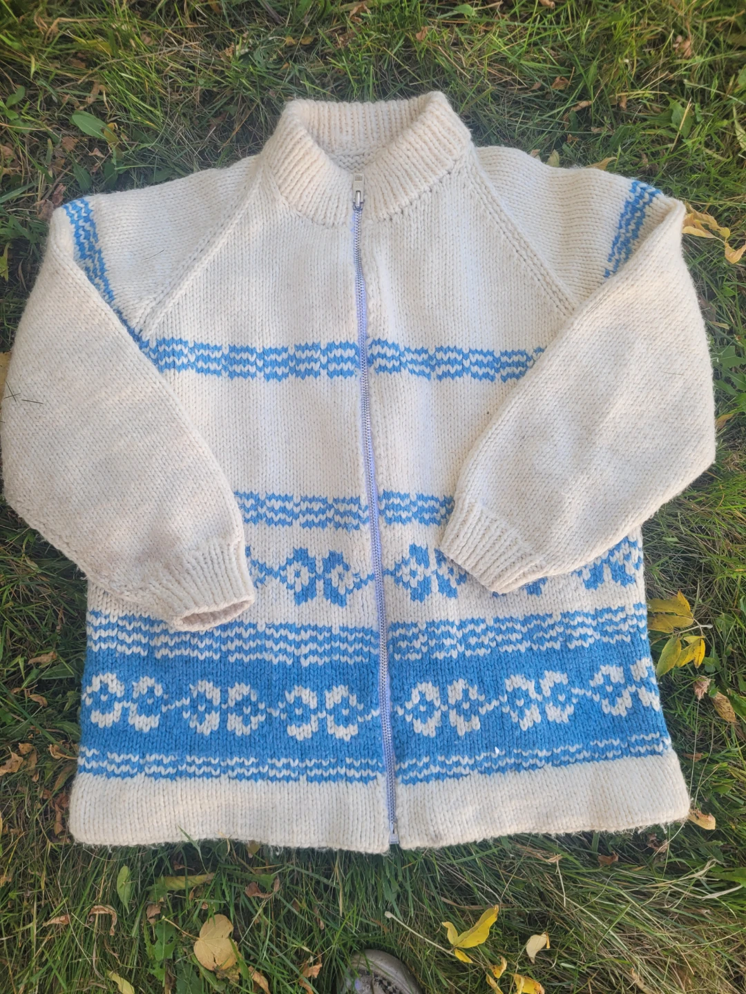 White and blue zip-up knit sweater