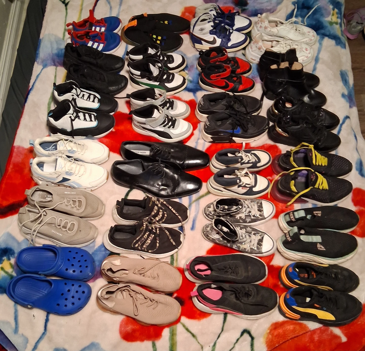 Assorted kids' shoes, as well as shoes for men and women.