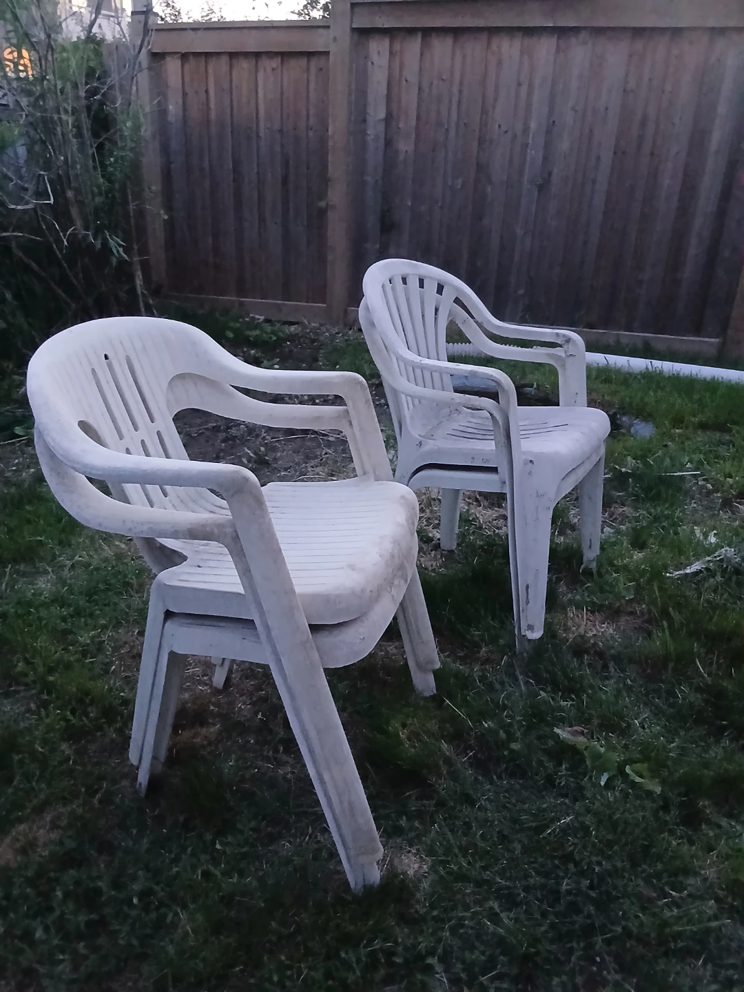 4 white outdoor chairs, stackable