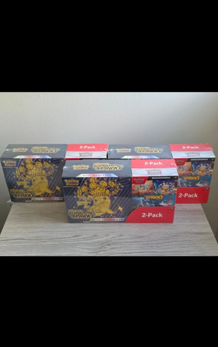 Pokemon Surging Sparks Elite Trainer Boxes and Booster Bundles