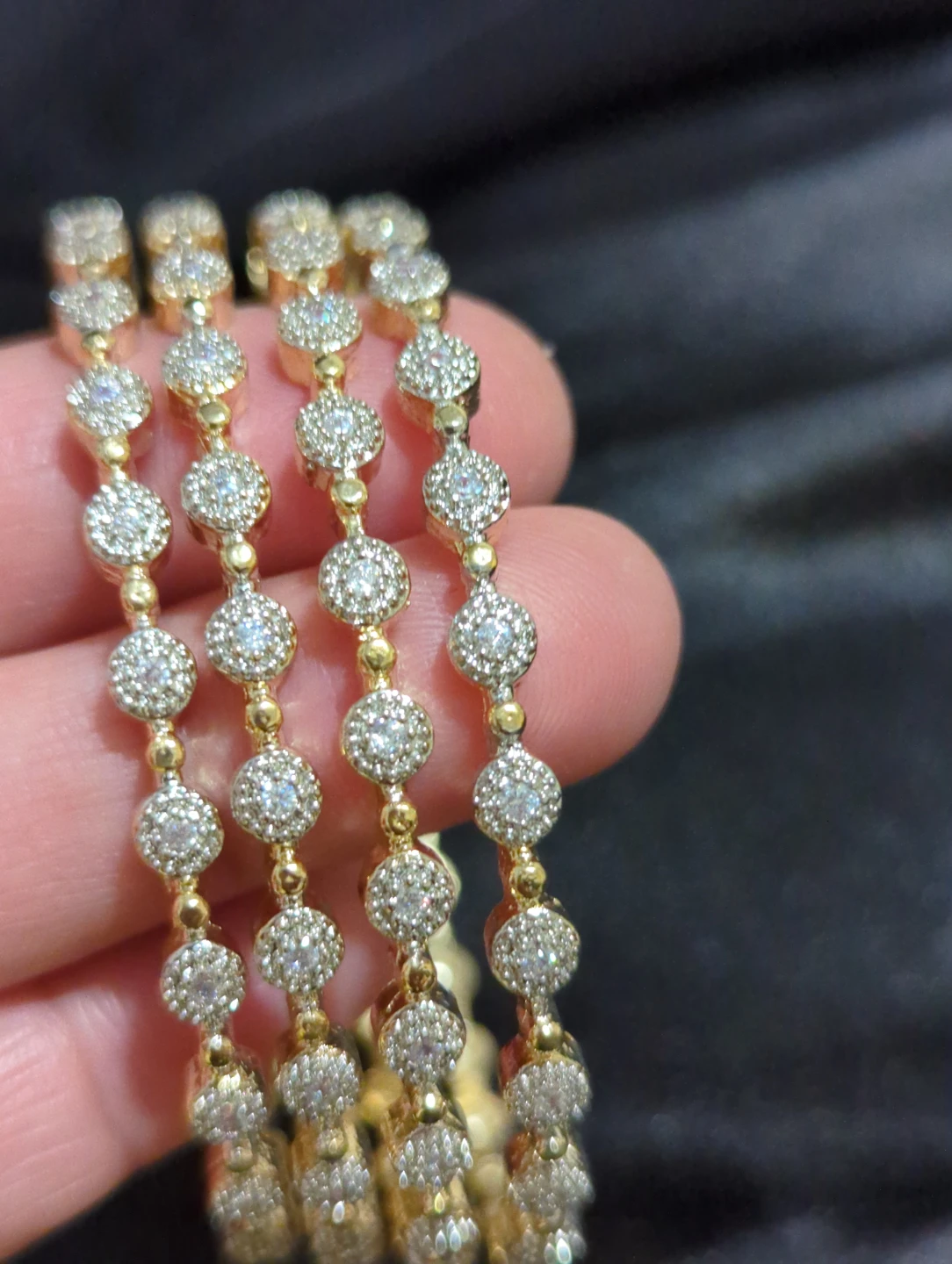 Set of four gold-tone bangles - photo 2