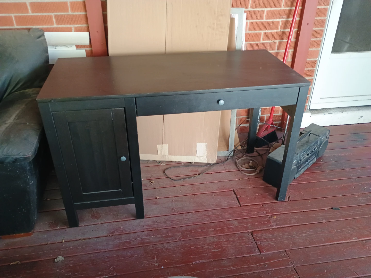 Black wooden desk with storage cabinet