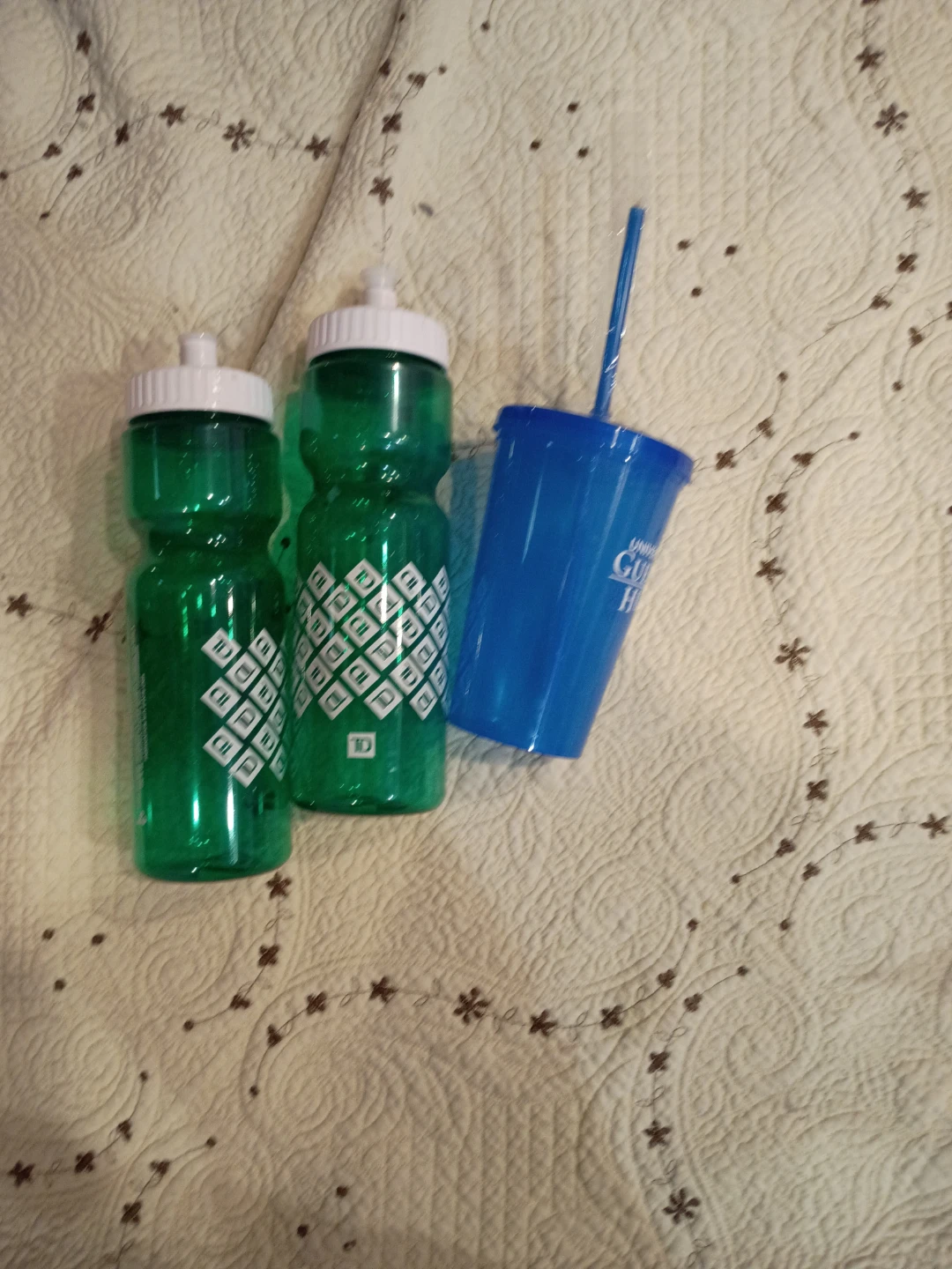 Two TD Water Bottles and One Blue Cup