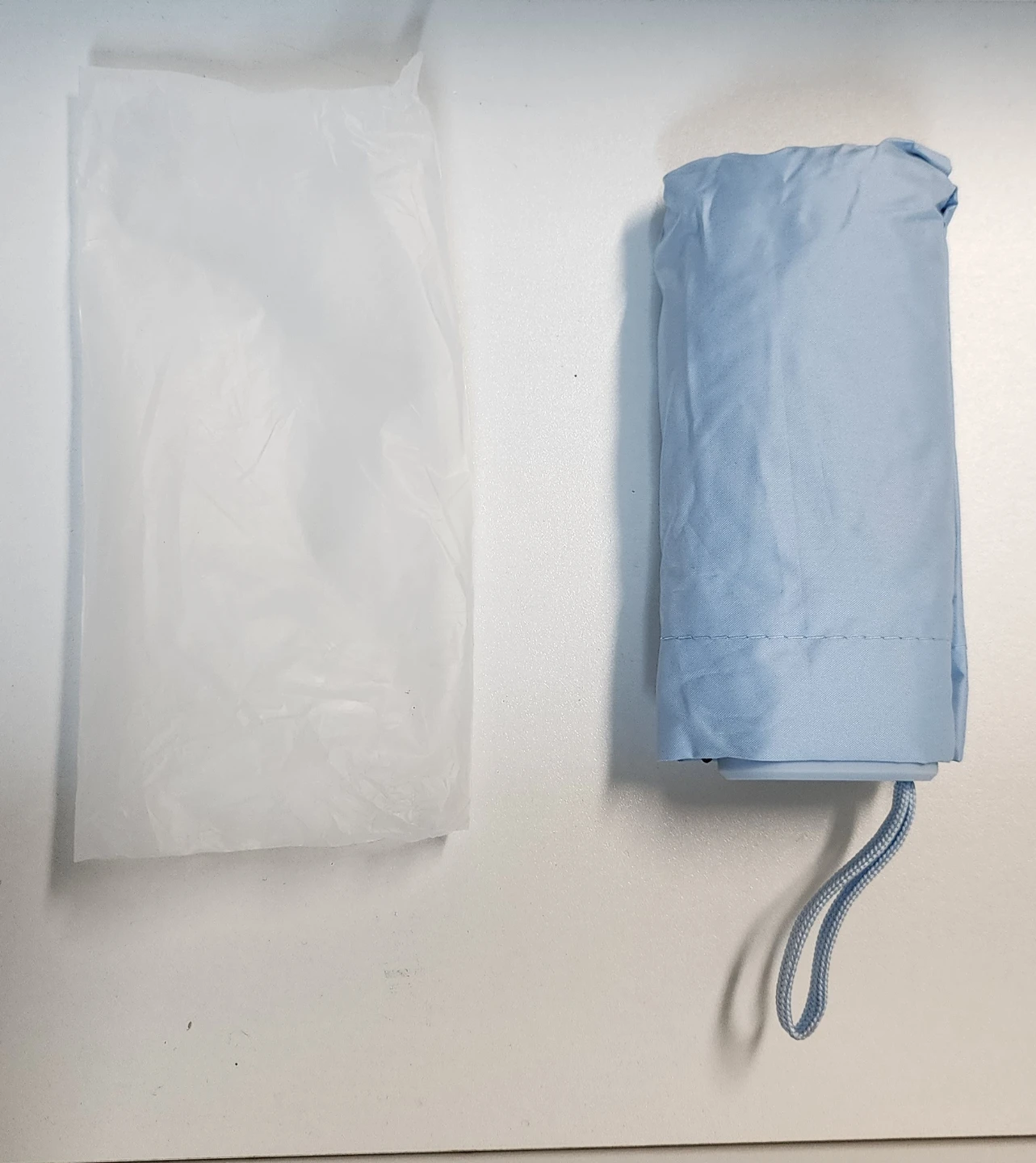 Light blue compact travel umbrella