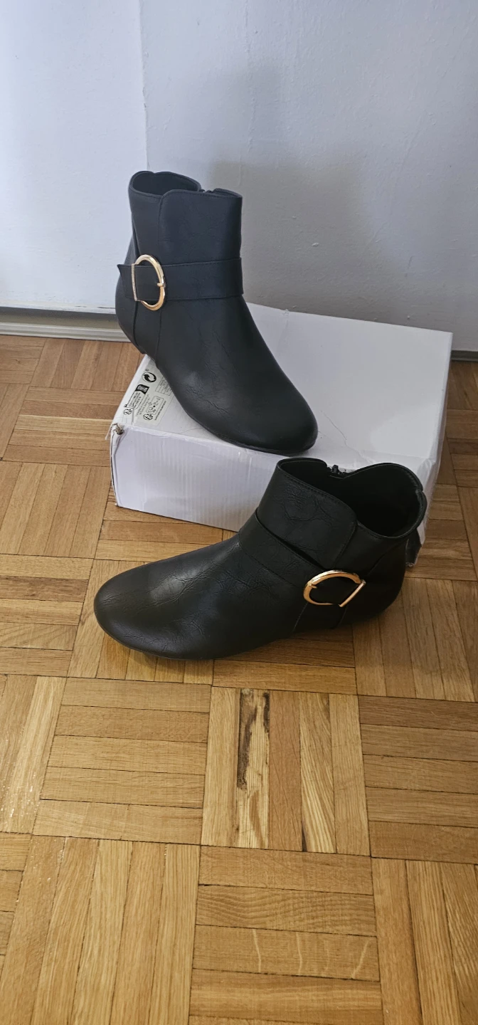 Black ankle boots with gold-tone buckle