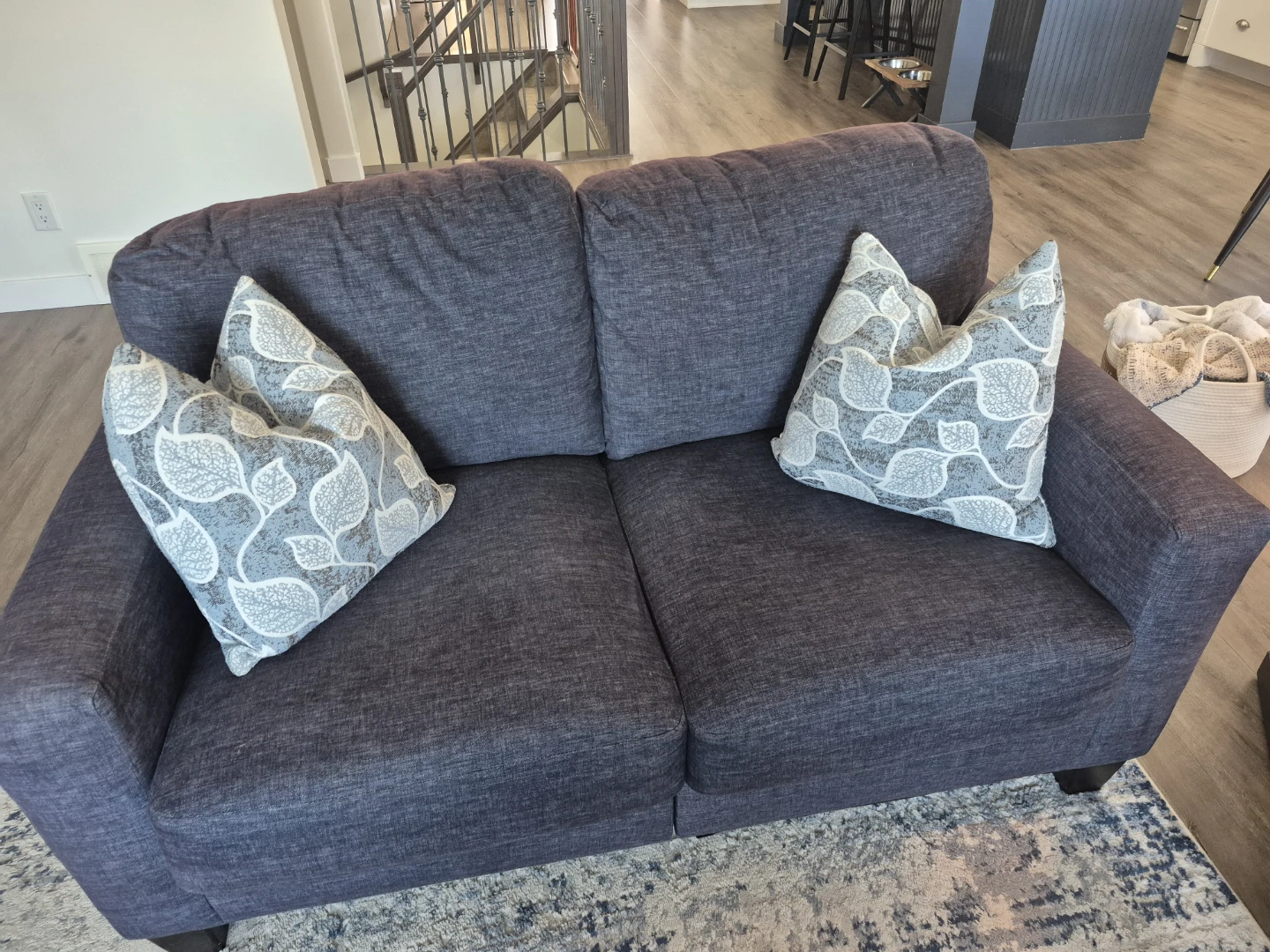 Blue Loveseat with Patterned Toss Cushions