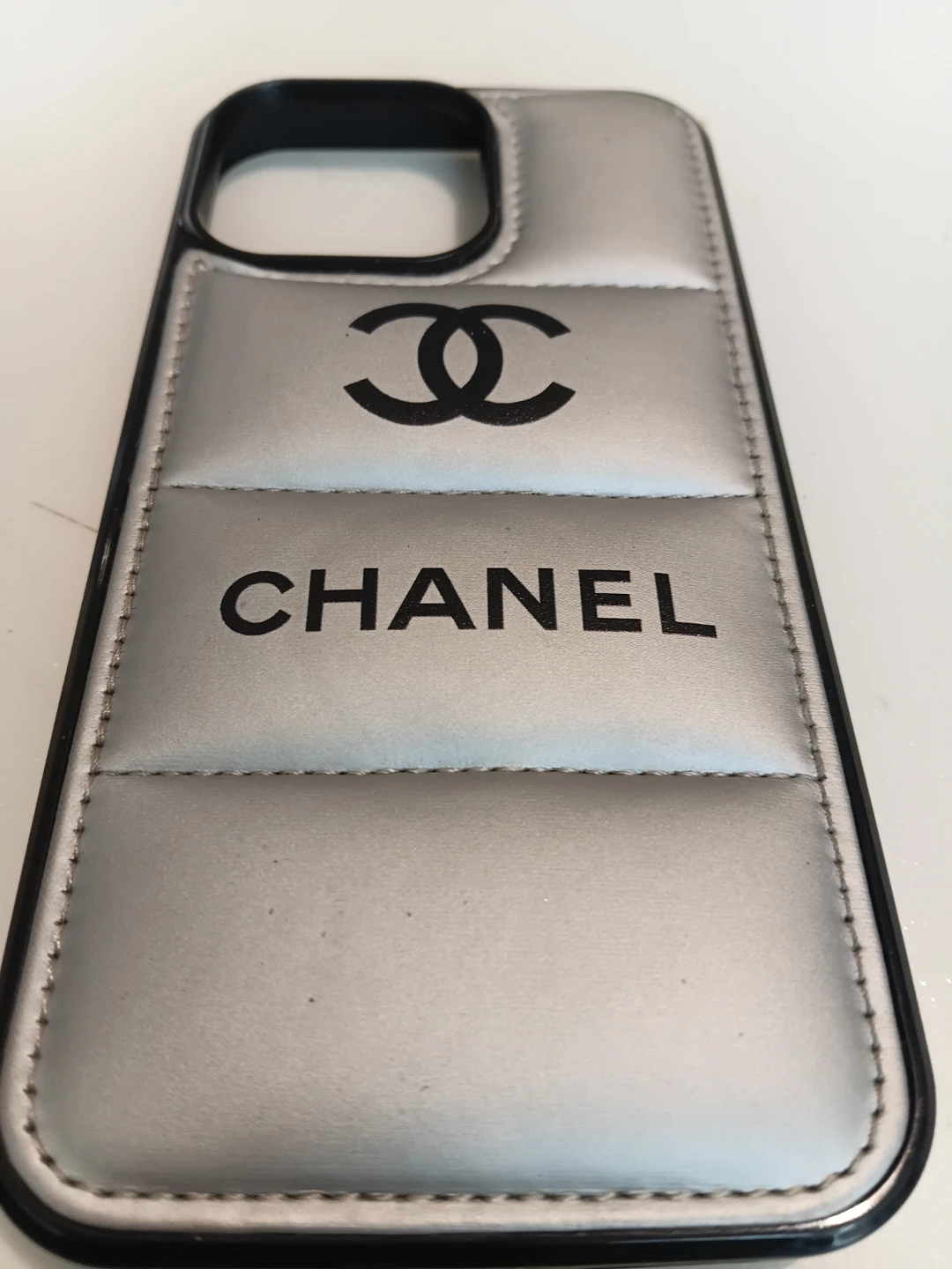 Chanel silver quilted phone case