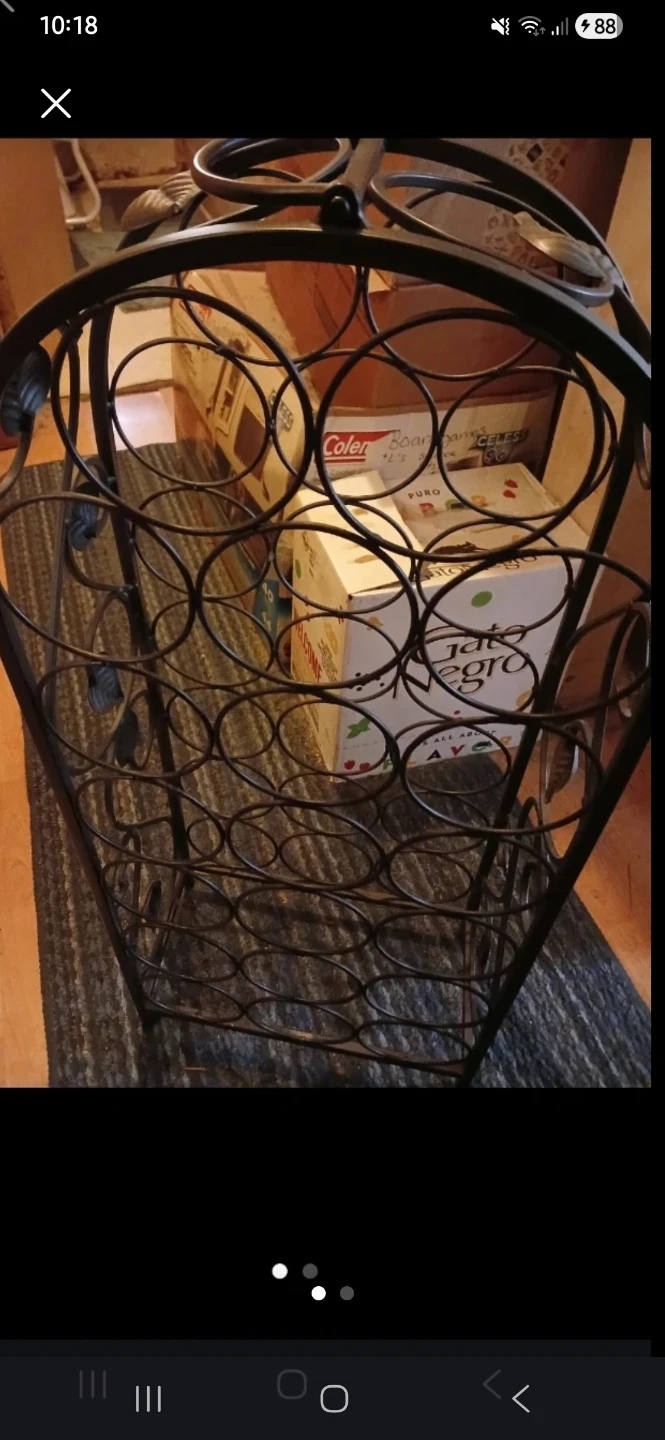Metal wine rack with decorative leaf details